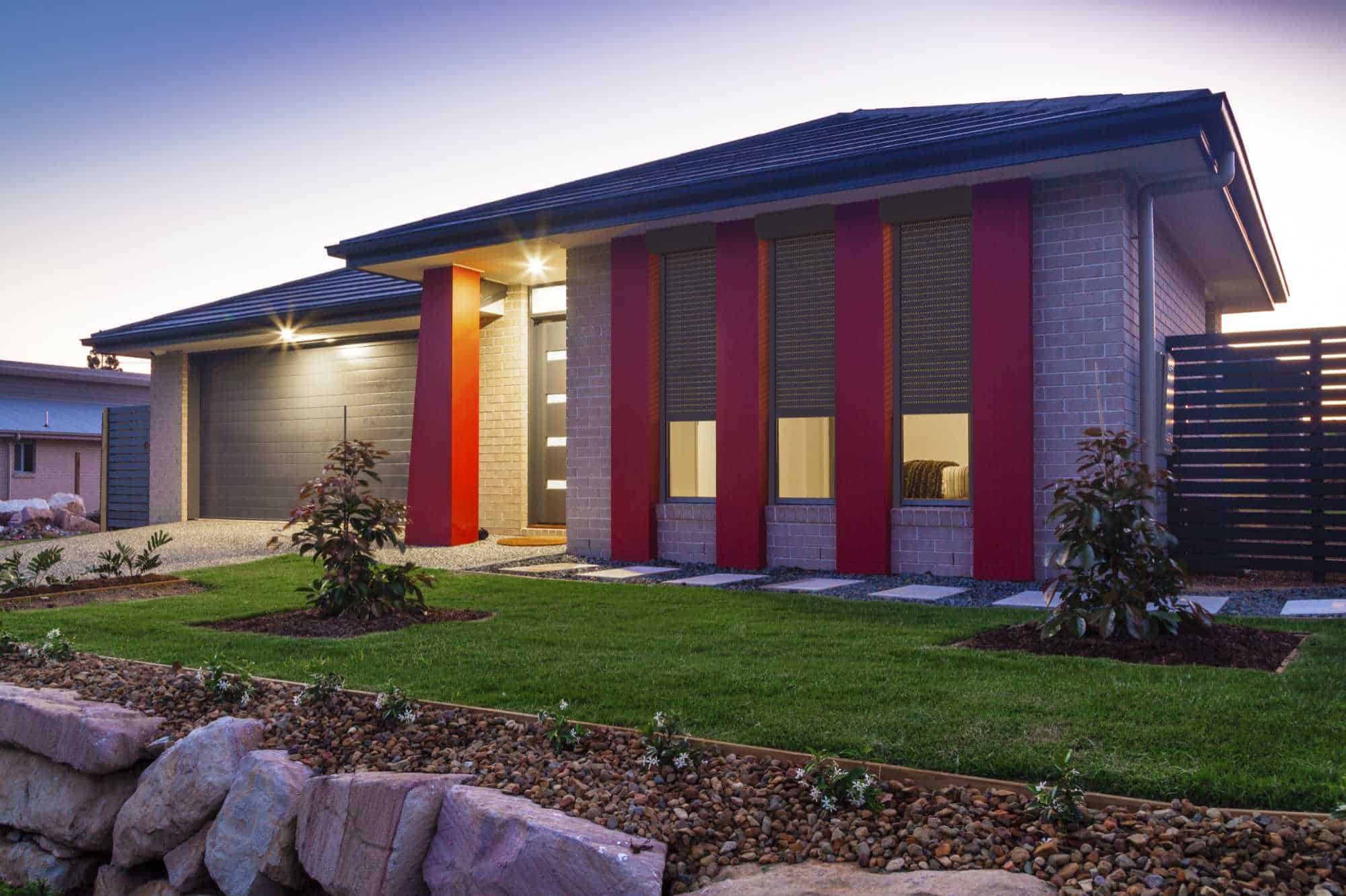 House with three roller shutters in the front enjoying energy savings because of the insulation