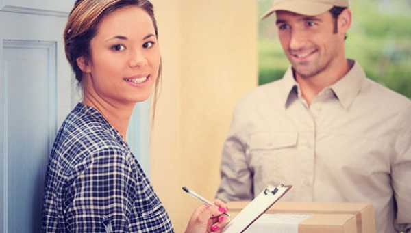 A delivery man delivering roller shutter order to a woman